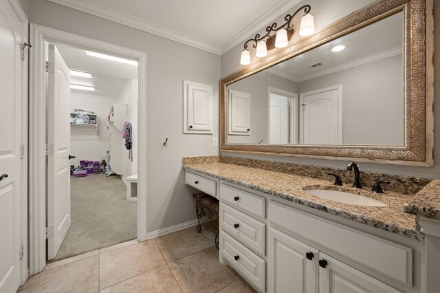 840 Falcon Ln, Coppell, TX 75019 - bathroom featuring vanity, baseboards, crown molding, and tile patterned floors