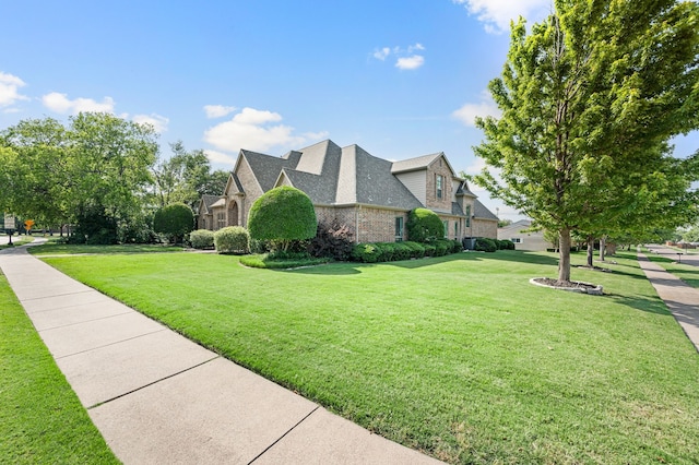 840 Falcon Ln, Coppell, TX 75019 - view of side of property with a lawn and brick siding