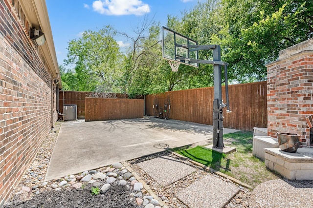 840 Falcon Ln, Coppell, TX 75019 - view of patio / terrace with central air condition unit and basketball hoop