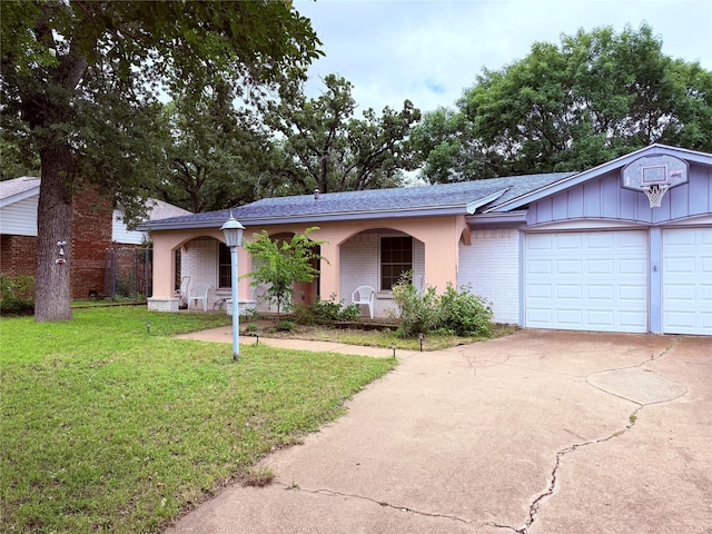 2906 SE 6th St, Mineral Wells, TX 76067 - ranch-style home with covered porch, brick siding, a front lawn, driveway, and an attached garage