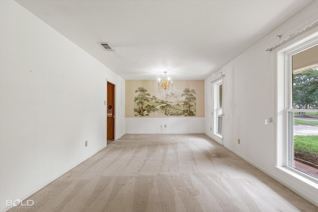 4404 Curtis Loop, Bossier City, LA 71112 - spare room with a chandelier and light colored carpet