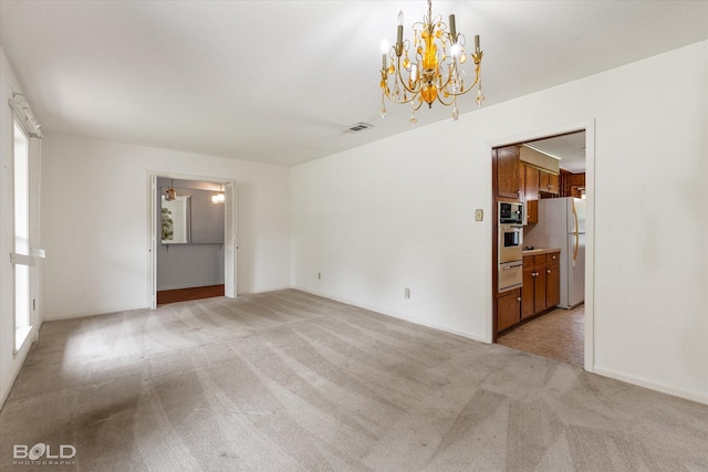 4404 Curtis Loop, Bossier City, LA 71112 - empty room featuring light carpet and a chandelier