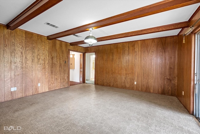 4404 Curtis Loop, Bossier City, LA 71112 - spare room with beam ceiling, wood walls, and carpet