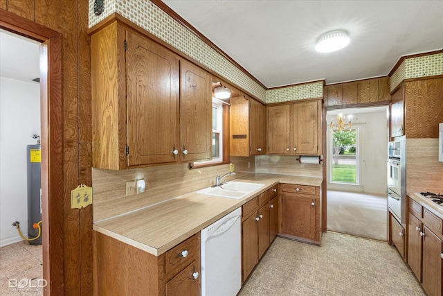 4404 Curtis Loop, Bossier City, LA 71112 - kitchen with white dishwasher, a sink, brown cabinetry, light countertops, and decorative backsplash
