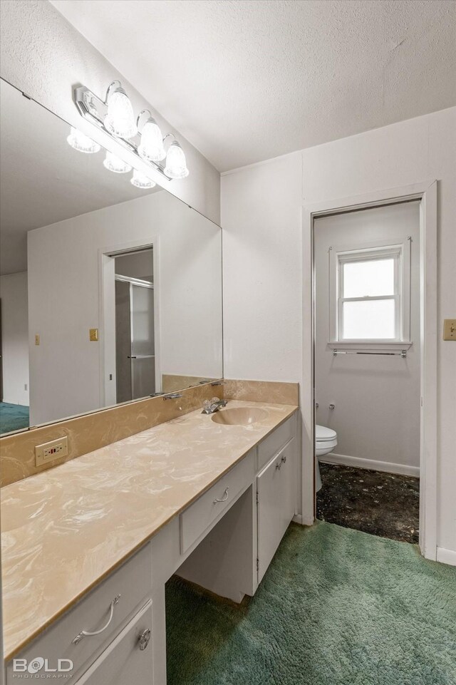 4404 Curtis Loop, Bossier City, LA 71112 - bathroom featuring vanity, toilet, a textured ceiling, and a shower