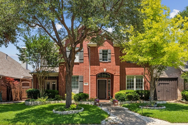 4104 Navarro Way, Frisco, TX 75034 - view of front of house with brick siding and a front yard
