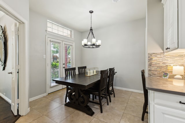 4104 Navarro Way, Frisco, TX 75034 - dining area with a chandelier, light tile patterned floors, and baseboards