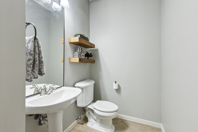 4104 Navarro Way, Frisco, TX 75034 - half bathroom with baseboards, toilet, and tile patterned flooring