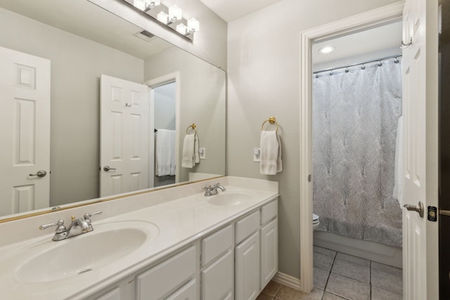 4104 Navarro Way, Frisco, TX 75034 - bathroom featuring double vanity, tile patterned flooring, and toilet