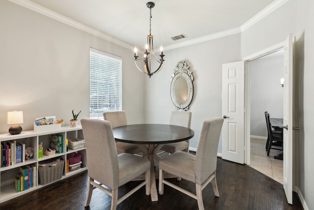 4104 Navarro Way, Frisco, TX 75034 - dining room with a chandelier, ornamental molding, dark wood finished floors, and baseboards