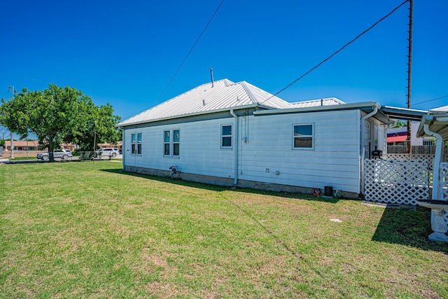 732 N Patrick St, Dublin, TX 76446 - back of house featuring a lawn