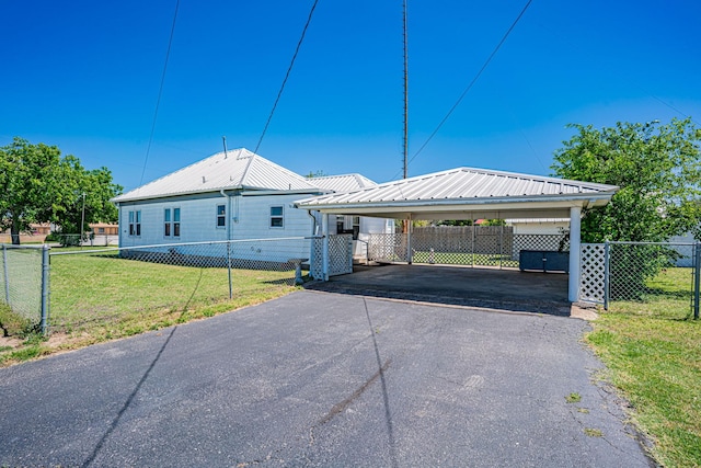 732 N Patrick St, Dublin, TX 76446 - view of front of home featuring asphalt driveway, a detached carport, and metal roof