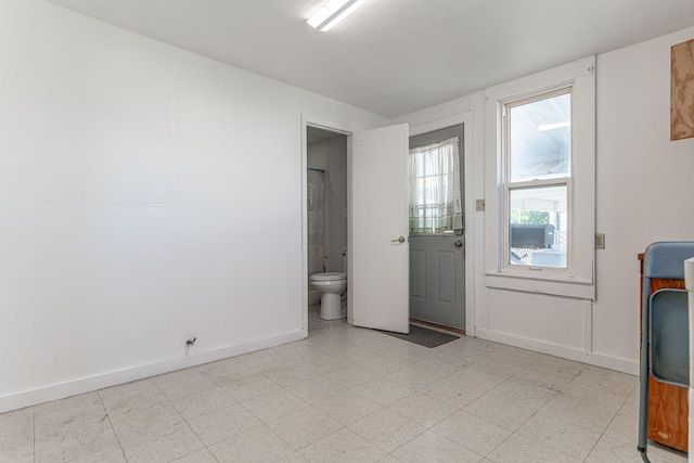 732 N Patrick St, Dublin, TX 76446 - doorway featuring light flooring and baseboards