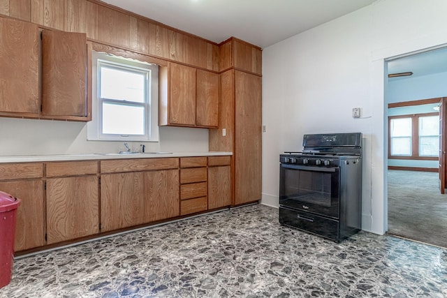 732 N Patrick St, Dublin, TX 76446 - kitchen with black range with gas stovetop, a sink, light countertops, and plenty of natural light