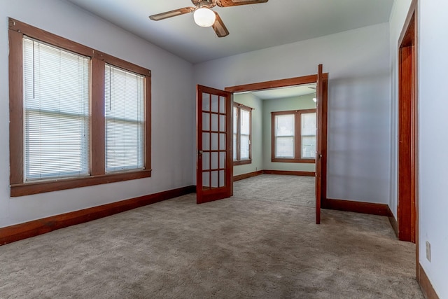 732 N Patrick St, Dublin, TX 76446 - unfurnished room featuring french doors, carpet, a ceiling fan, and baseboards