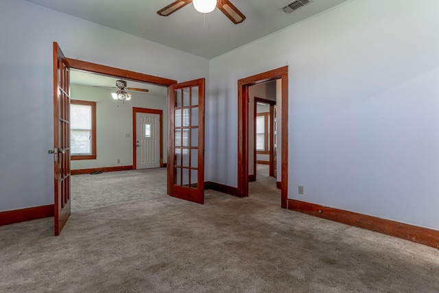 732 N Patrick St, Dublin, TX 76446 - spare room with french doors, a ceiling fan, carpet flooring, and baseboards