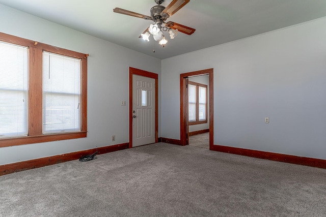 732 N Patrick St, Dublin, TX 76446 - carpeted entrance foyer featuring baseboards, healthy amount of natural light, and a ceiling fan