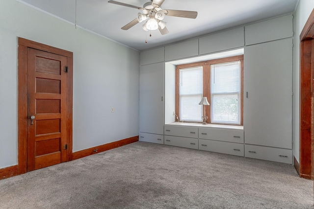 732 N Patrick St, Dublin, TX 76446 - unfurnished bedroom with light carpet, baseboards, crown molding, and a ceiling fan
