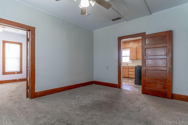732 N Patrick St, Dublin, TX 76446 - empty room with attic access, a ceiling fan, and carpet flooring