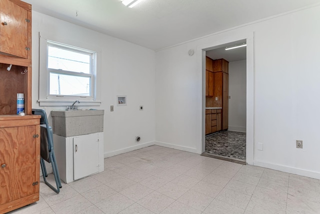 732 N Patrick St, Dublin, TX 76446 - laundry room featuring electric dryer hookup, baseboards, hookup for a washing machine, and light flooring