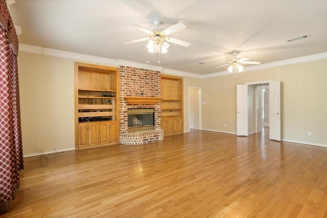 1642 Greenview Ct, Aledo, TX 76008 - unfurnished living room with crown molding, light wood-style floors, a ceiling fan, a fireplace, and built in shelves