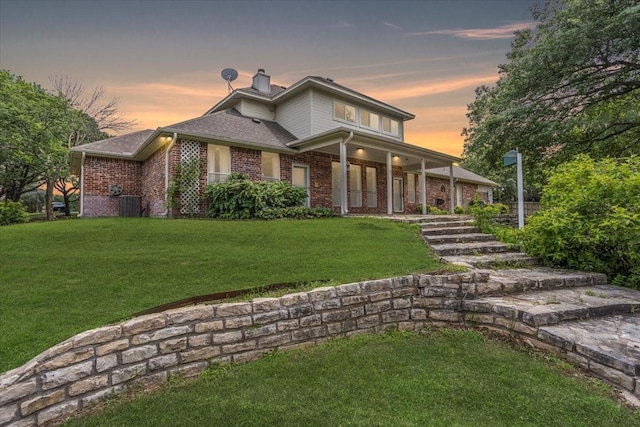 1642 Greenview Ct, Aledo, TX 76008 - view of front of home featuring brick siding, a lawn, a chimney, a porch, and a shingled roof
