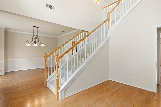 1642 Greenview Ct, Aledo, TX 76008 - staircase featuring wood finished floors, ornamental molding, and a chandelier