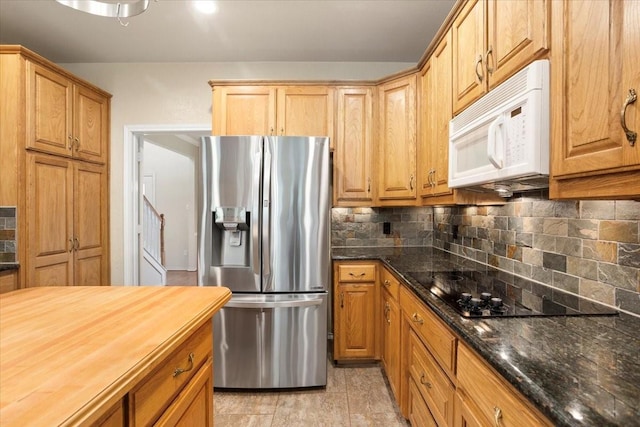 1642 Greenview Ct, Aledo, TX 76008 - kitchen featuring stainless steel fridge with ice dispenser, white microwave, backsplash, wooden counters, and black electric cooktop