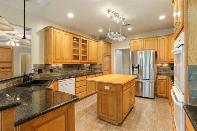 1642 Greenview Ct, Aledo, TX 76008 - kitchen with stainless steel refrigerator with ice dispenser, dishwasher, decorative backsplash, ceiling fan, and recessed lighting