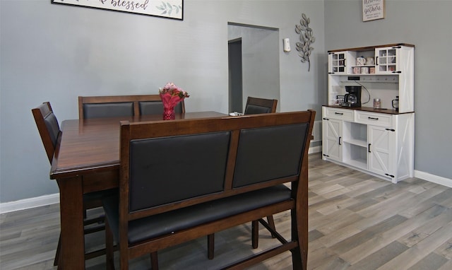 2421 Langston St, Fort Worth, TX 76105 - dining area with baseboards and light wood-style flooring