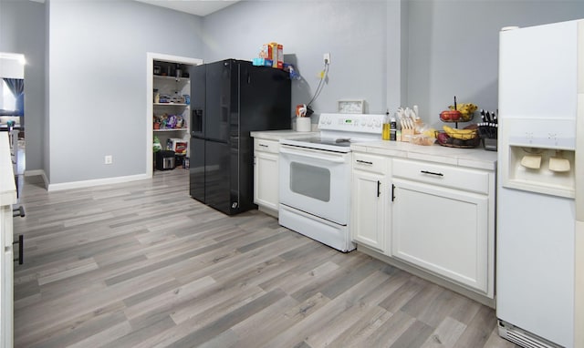 2421 Langston St, Fort Worth, TX 76105 - kitchen featuring white appliances, light wood-style flooring, white cabinetry, and tile counters
