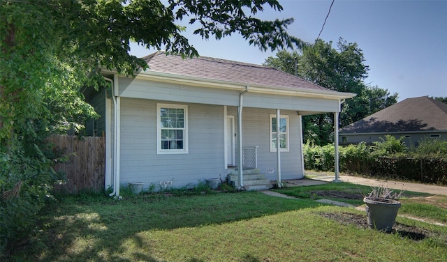 2421 Langston St, Fort Worth, TX 76105 - view of front facade with roof with shingles and a porch
