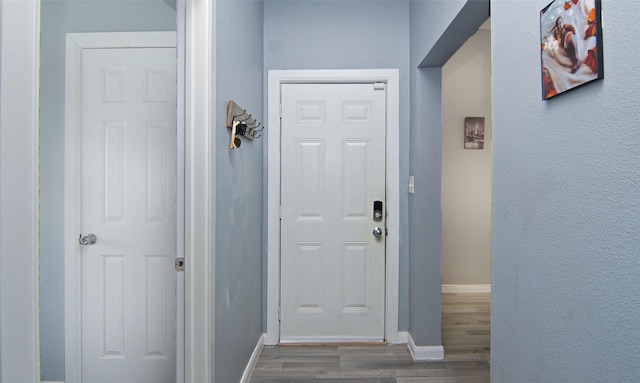 2421 Langston St, Fort Worth, TX 76105 - doorway to outside featuring wood finished floors and baseboards