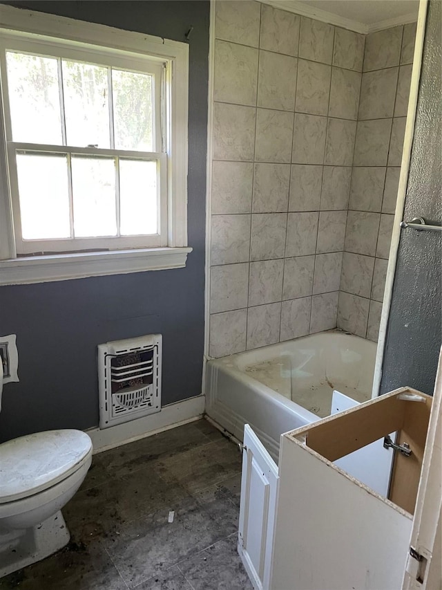 601 N Newsom St, Mineola, TX 75773 - bathroom featuring heating unit, toilet, and baseboards
