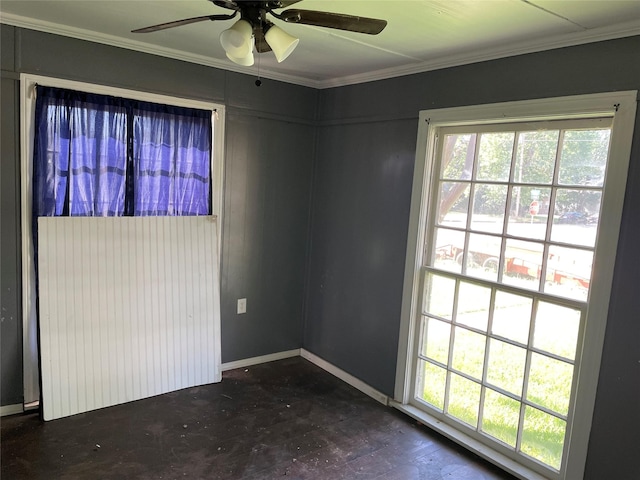 601 N Newsom St, Mineola, TX 75773 - empty room featuring crown molding, healthy amount of natural light, a ceiling fan, and baseboards