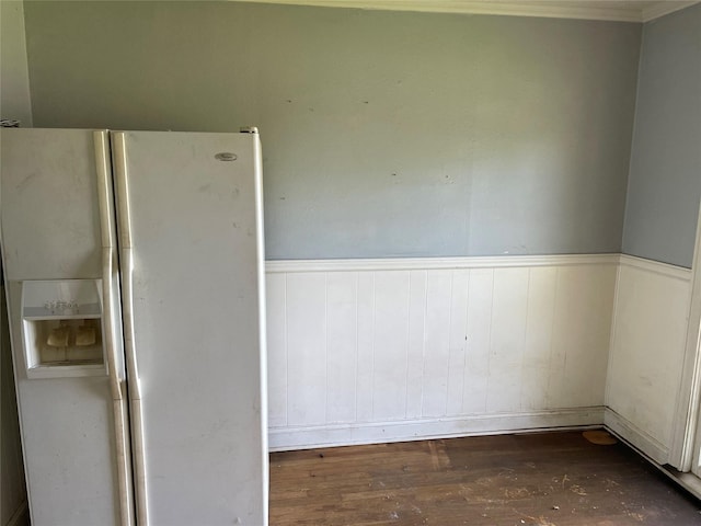 601 N Newsom St, Mineola, TX 75773 - unfurnished room featuring wood finished floors, wainscoting, and ornamental molding