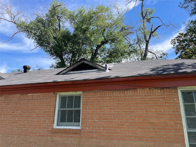 601 N Newsom St, Mineola, TX 75773 - exterior view of brick siding and roof with shingles