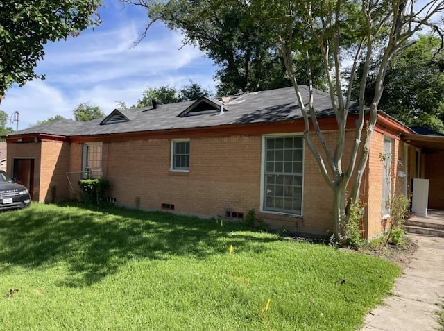 601 N Newsom St, Mineola, TX 75773 - view of side of home featuring brick siding, a yard, and driveway