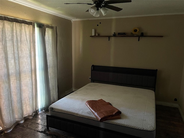 601 N Newsom St, Mineola, TX 75773 - bedroom with ornamental molding, multiple windows, a ceiling fan, wood finished floors, and baseboards