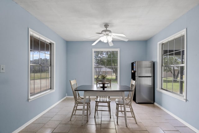 5161 N Hwy 271, Pittsburg, TX 75686 - tiled dining area with plenty of natural light, a ceiling fan, and baseboards
