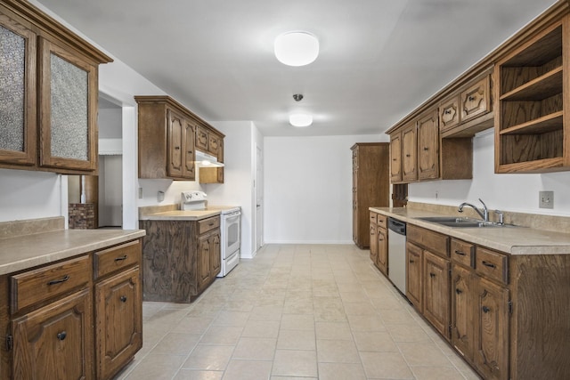 5161 N Hwy 271, Pittsburg, TX 75686 - kitchen featuring white electric range, stainless steel dishwasher, a sink, under cabinet range hood, and light countertops