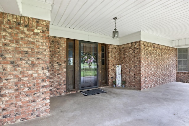 5161 N Hwy 271, Pittsburg, TX 75686 - doorway to property with brick siding and a porch