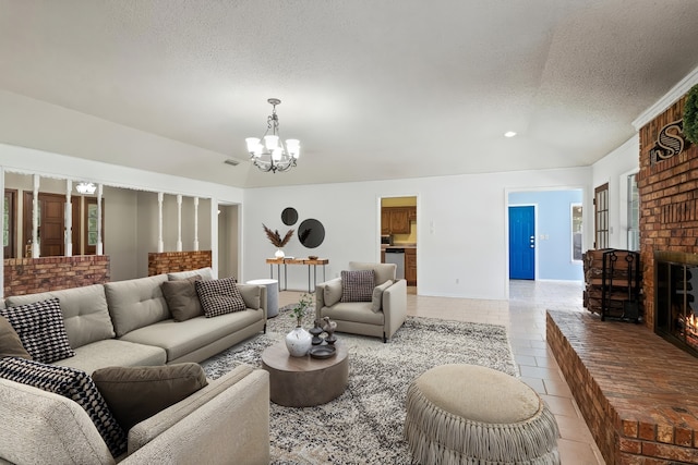 5161 N Hwy 271, Pittsburg, TX 75686 - living room with a chandelier, a textured ceiling, a fireplace, light tile patterned floors, and baseboards