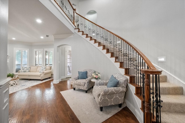 7000 Shalimar Ct, Colleyville, TX 76034 - stairway featuring arched walkways, ornamental molding, wood finished floors, baseboards, and recessed lighting