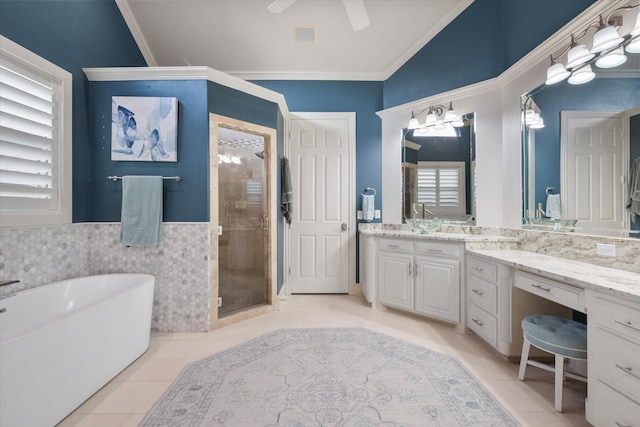 7000 Shalimar Ct, Colleyville, TX 76034 - bathroom with a shower stall, a soaking tub, tile patterned floors, vanity, and crown molding