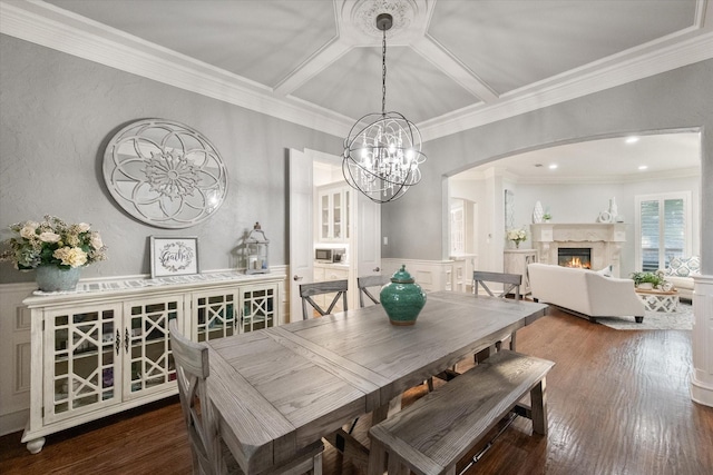 7000 Shalimar Ct, Colleyville, TX 76034 - dining area with arched walkways, a premium fireplace, crown molding, a chandelier, and wood finished floors