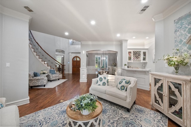 7000 Shalimar Ct, Colleyville, TX 76034 - living area featuring arched walkways, stairs, crown molding, wood finished floors, and recessed lighting