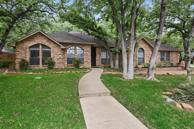 2420 Cross Timbers Trl, Arlington, TX 76006 - view of front of property featuring a shingled roof, a front yard, and brick siding