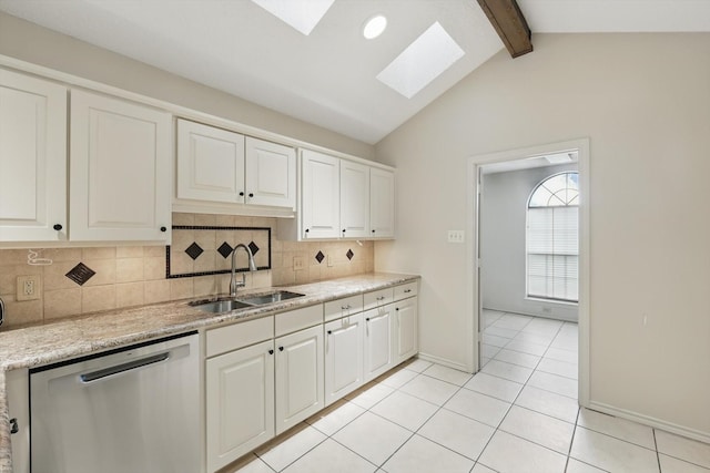 2420 Cross Timbers Trl, Arlington, TX 76006 - kitchen with a sink, dishwasher, a skylight, decorative backsplash, and light tile patterned flooring