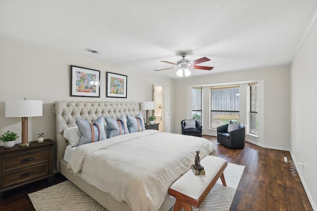 2420 Cross Timbers Trl, Arlington, TX 76006 - bedroom with a textured ceiling, dark wood finished floors, baseboards, ceiling fan, and crown molding